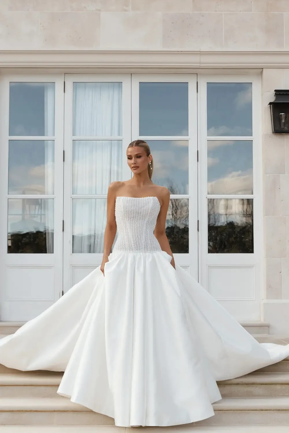 model is wearing a strapless bridal gown