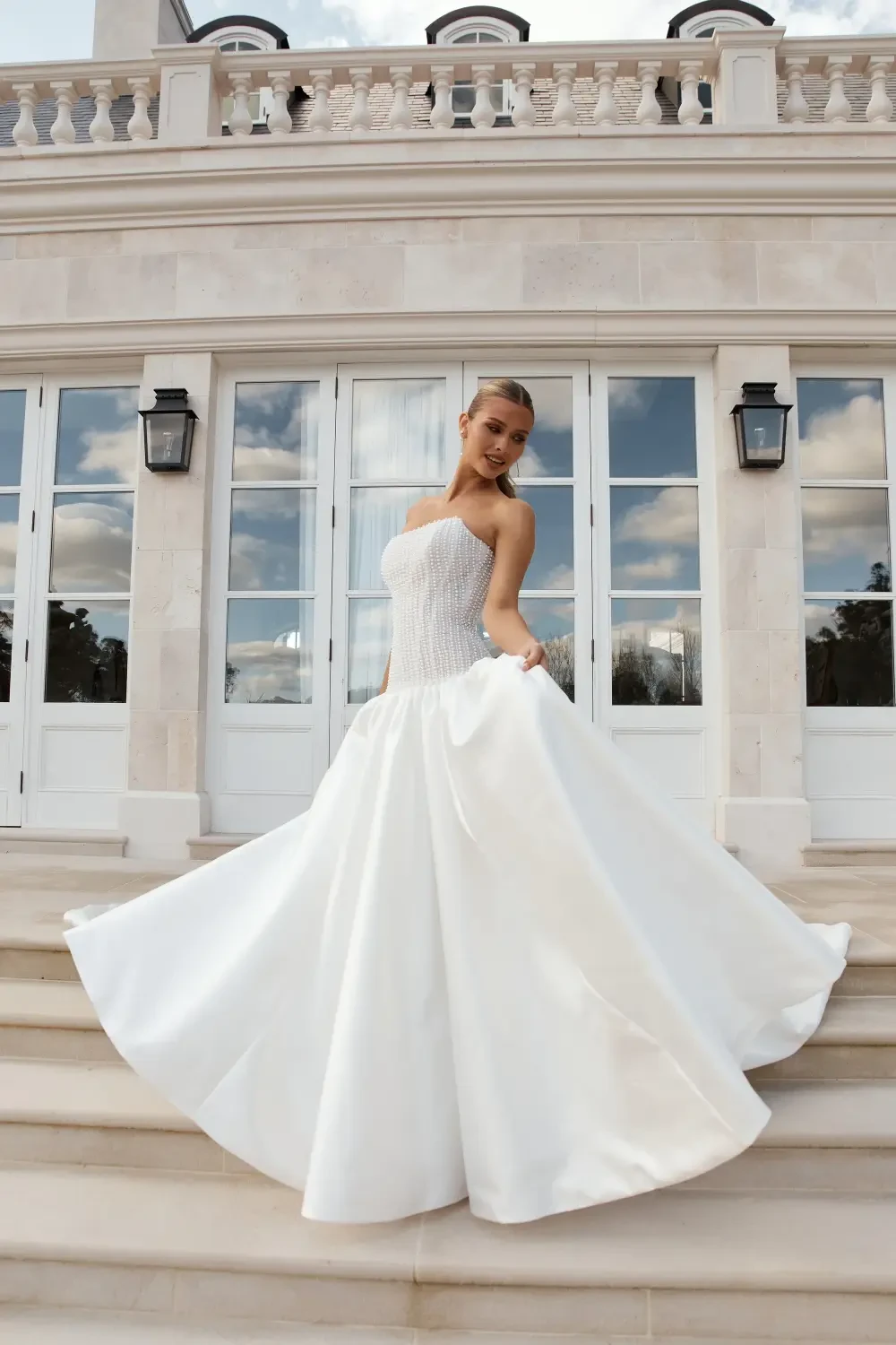 model is wearing a strapless bridal gown