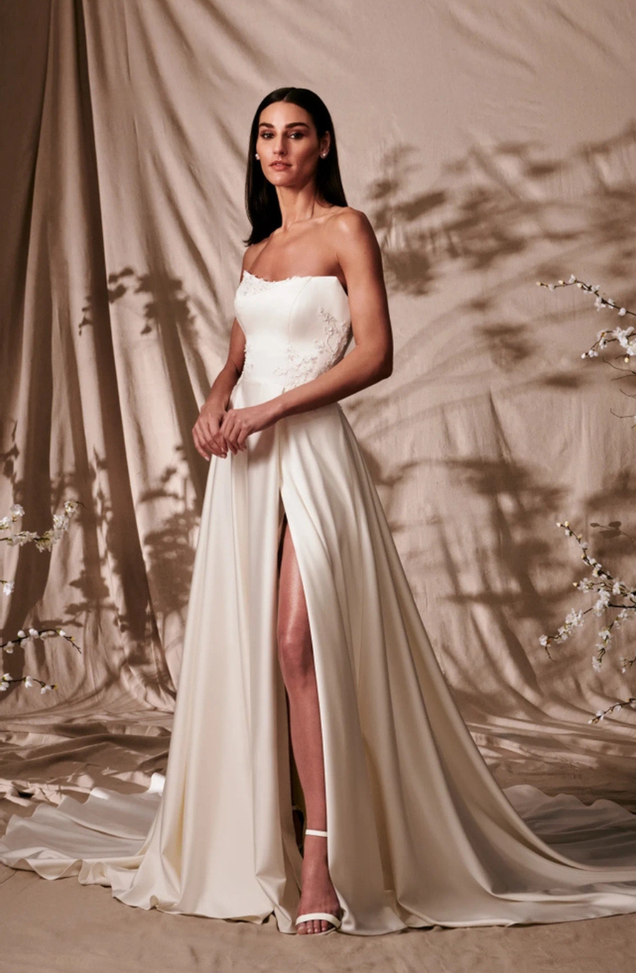 model wears a strapless bridal gown