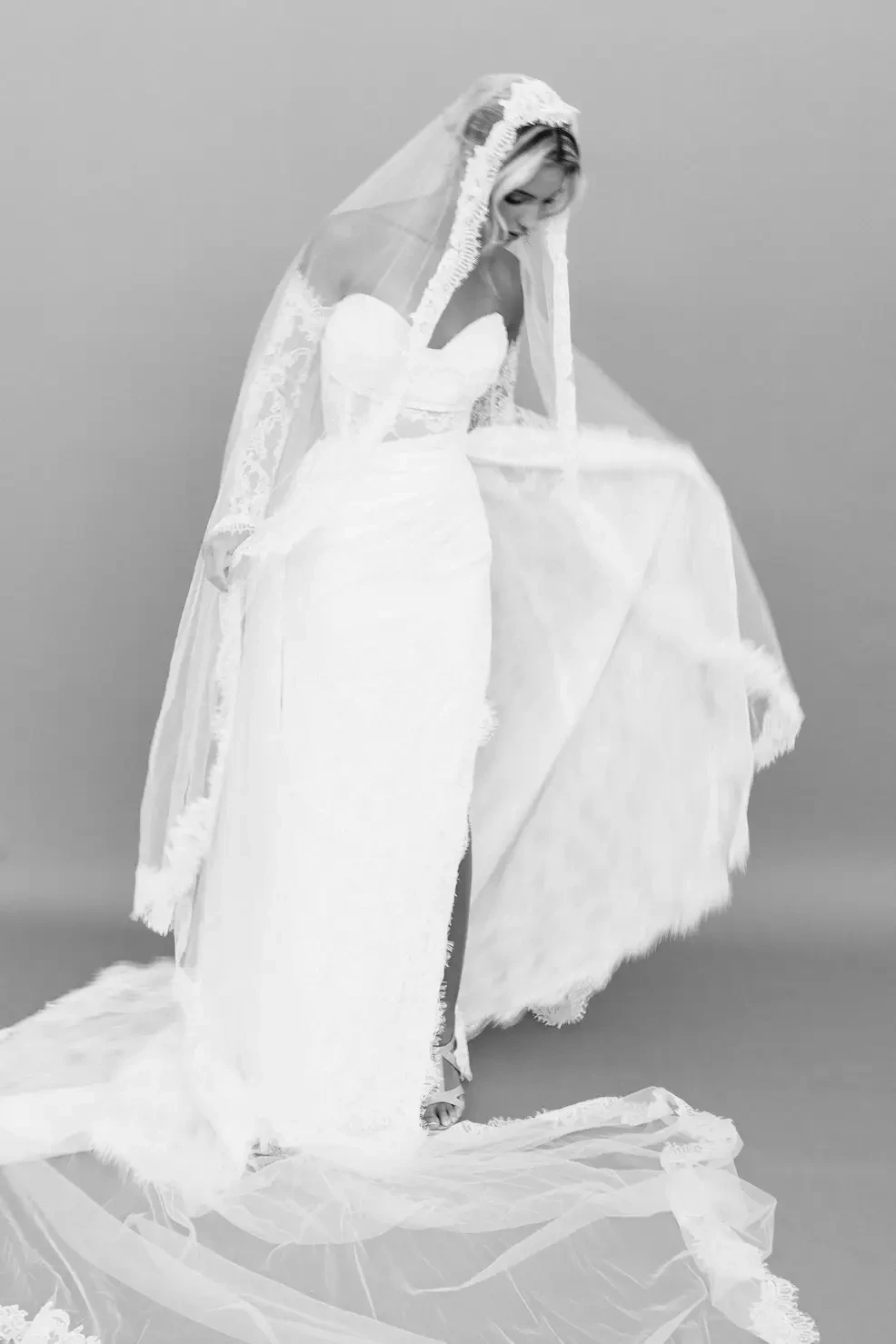 Photo of Bride in lace wedding dress and lace veil for The Bridal Loft in Greenville SC